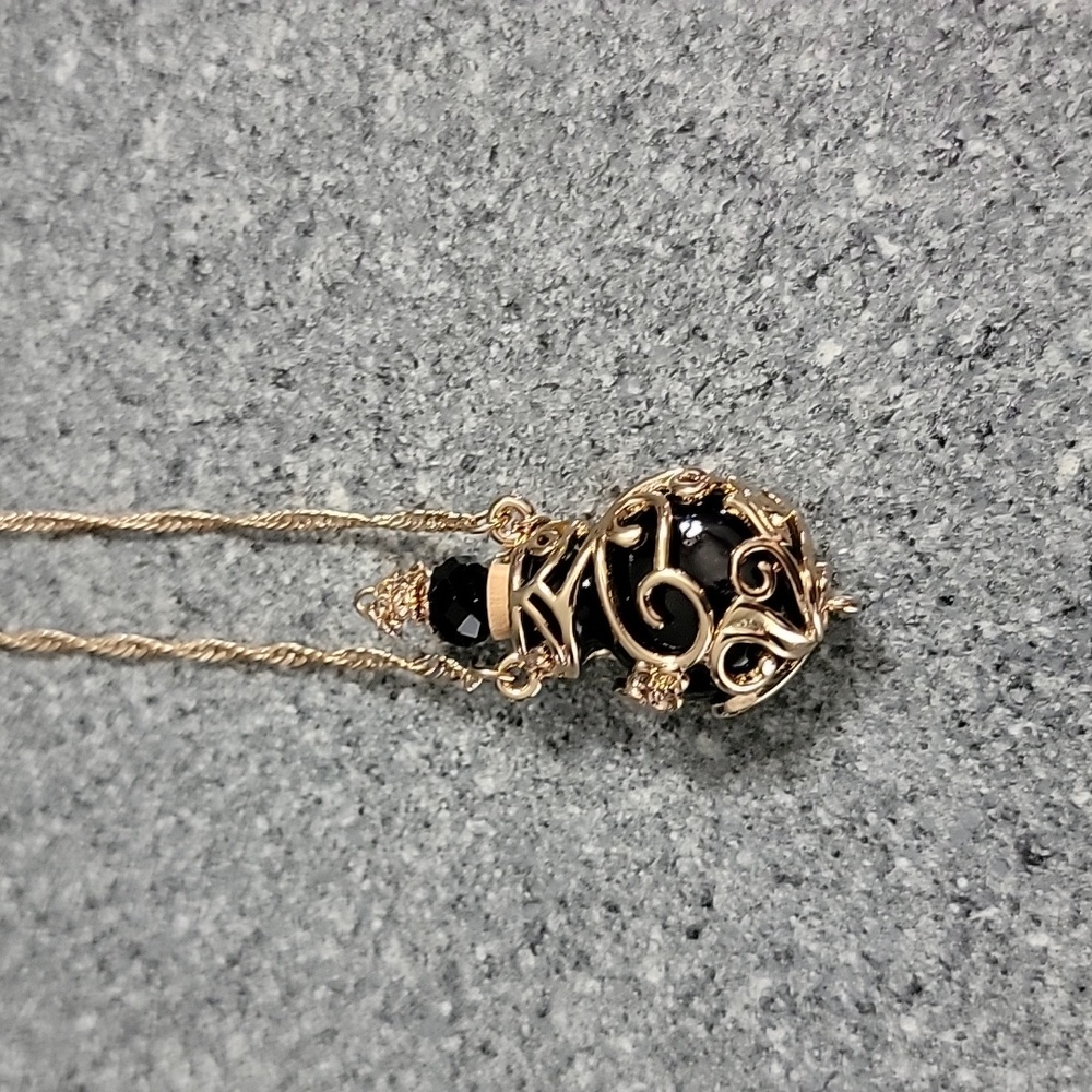 New without tags, Poison bottle necklace Goldtone and black